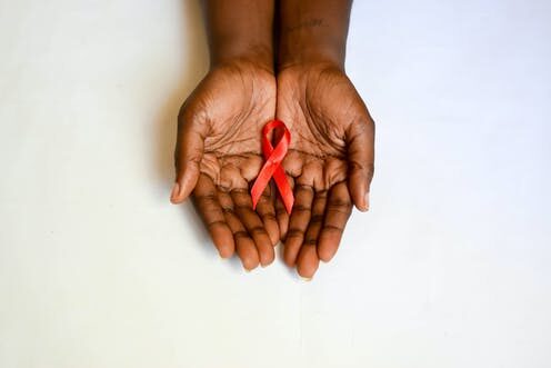 hands holding ribbon Afolabi
